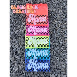 May include: Stack of six t-shirts with a checkered pattern and the word "Mama" in a retro font. The shirts are in various colors, including pink, yellow, blue, and green.