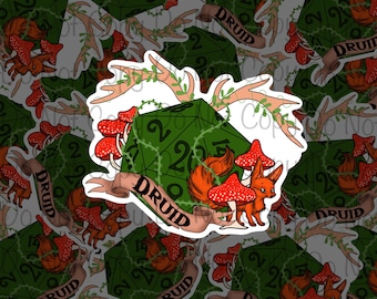 May include: A sticker featuring a green twenty-sided die with the number 20 visible, a fox, and red mushrooms. The word "DRUID" is on a banner. The design includes antlers and vines, creating a fantasy theme.
