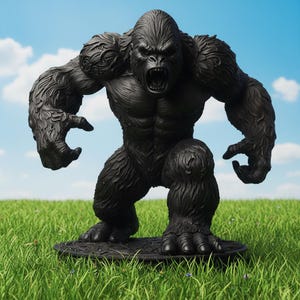 May include: A black gorilla statue with an open mouth, standing on a circular base. The gorilla has detailed fur and muscular features. The statue is set against a backdrop of green grass and a blue sky with clouds.