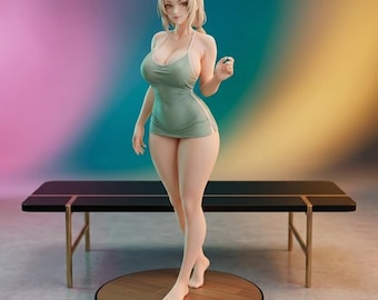 May include: A figurine of a woman with blonde hair wearing a light green halter dress with white trim. The figure is standing on a wooden platform in front of a black table with gold legs. The background is a gradient of pink, blue, and yellow.