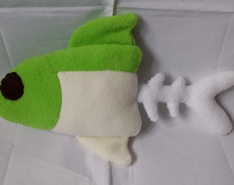 May include: A green and white plush fish toy with a white bone-shaped tail. The fish has a black eye.