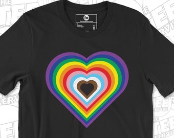 May include: Black t-shirt with a rainbow heart design. The heart is made up of concentric circles of different colors, including red, orange, yellow, green, blue, indigo, and violet. The heart is centered on the shirt and is the main design element.