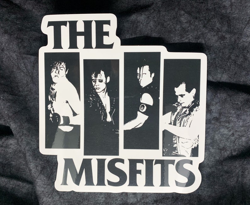May include: Black and white sticker featuring a band logo with the text "THE MISFITS" and four band members in silhouette.
