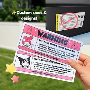May include: Two pink and white warning stickers with cartoon characters and safety information. The stickers read "WARNING" and include text about child safety in vehicles. The image also includes the text "Custom sizes & designs!"
