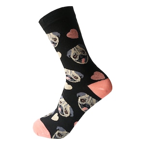 May include: Black socks with a pattern of pugs and pink hearts. The socks have a pink heel and toe.