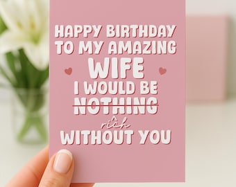 以下が含まれることがあります： 「HAPPY BIRTHDAY TO MY AMAZING WIFE I WOULD BE NOTHING rich WITHOUT YOU」と書かれた白い文字が入ったピンク色のバースデーカード。カードは手で持たれています。