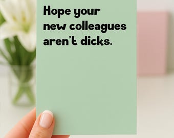 May include: A rectangular greeting card with a light green background and black text that reads, Hope your new colleagues aren't dicks. The card features a clean, modern font and a simple, straightforward design for a professional or personal occasion.