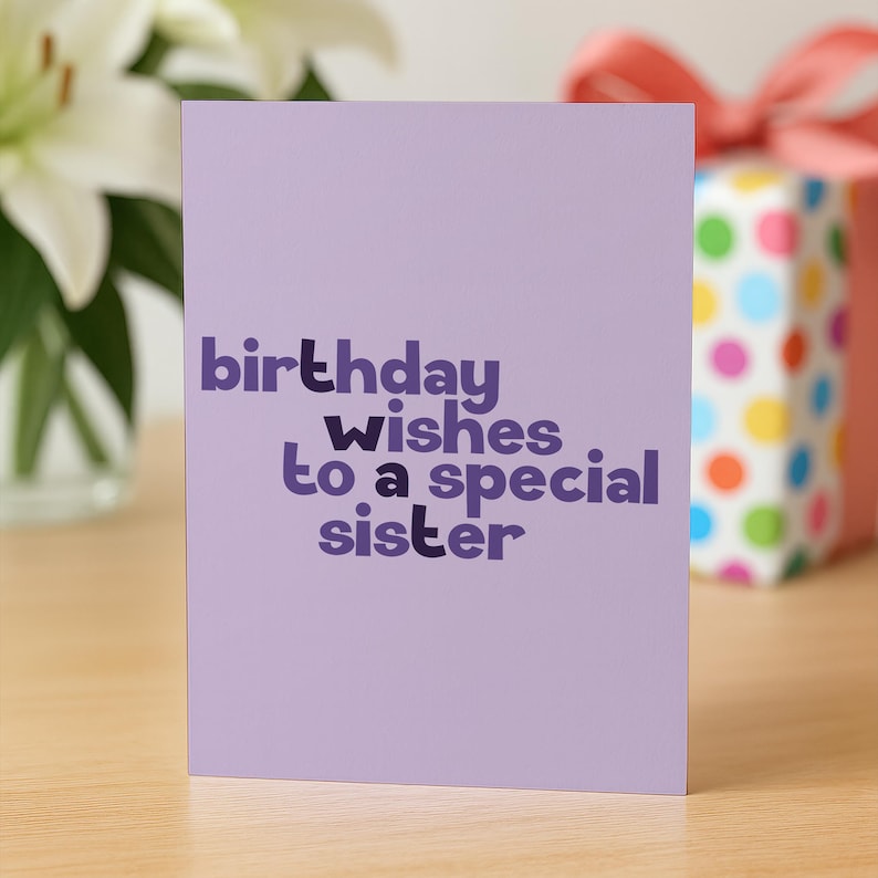 May include: A lavender birthday card with the text "birthday wishes to a special sister" in purple. A gift box with a pink ribbon and colorful polka dots is visible in the background.