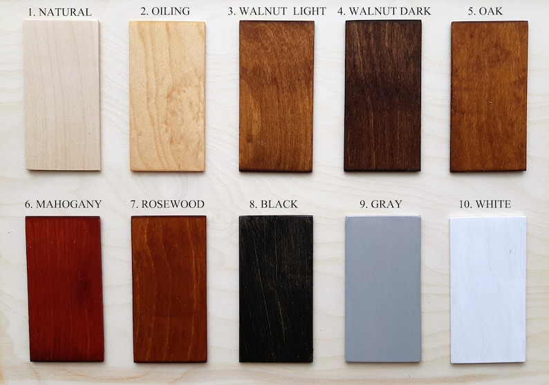 May include: A collection of ten rectangular wood samples showcasing various finishes. The samples include "Natural," "Oiling," "Walnut Light," "Walnut Dark," "Oak," "Mahogany," "Rosewood," "Black," "Gray," and "White," each labeled with its respective name.