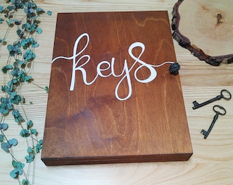 Natural wooden box handmade to hang on the wall with 16 key hooks, lockable and painted with eco-friendly paints, hand-painted custom sign