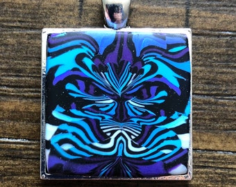 Pendentif de chat de Cheshire fâché