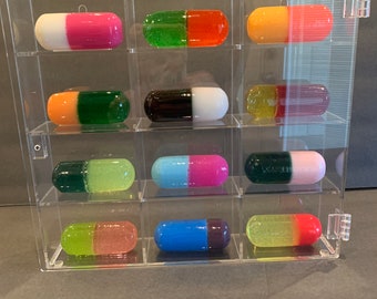 Pop-Art capsules in acrylic display pills pharmacy