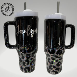 Leopard print tumbler on a black background and silver glitter, animal print cup, black and silver tumbler personalizeable with any name.