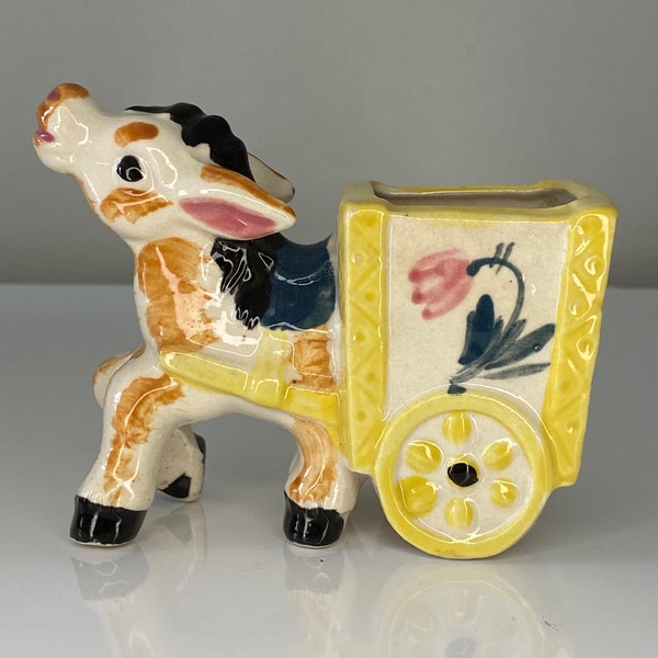 Cute as a button donkey pulling cart - great for a succulent!