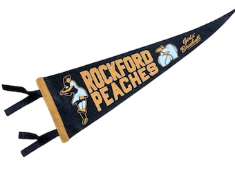 Rockford Peaches 1950s antique-inspired championship pennant, 7x21, navy and antique gold felt, 2 color printing.