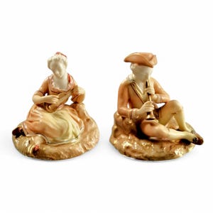 Royal Worcester porcelain figurines, pair of lounging musicians, shape 547, dated 1913, blush caramel tones, gilt detail, rare antique set