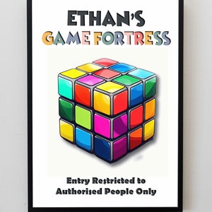 May include: A colourful, cube-shaped sign with the text "Ethan's Game Fortress" in black and colourful letters. The sign also includes the text "Entry Restricted to Authorised People Only" in black letters.