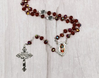 Our Lady of Guadalupe rosary beads Iridescent crystal red glass with a liturgy crucifix and flower pater beads