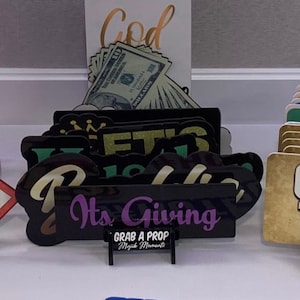 Photo booth store prop holder
