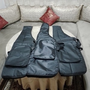 May include: Three black guitar cases with zippered pockets and adjustable straps. The cases are made of a durable, water-resistant material.