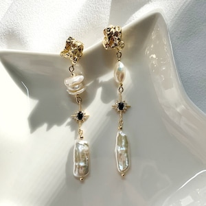 Freshwater Keshi Pearl Earring. White Biwa Pearl Dangle Earring. Mismatched Pearl Drop Earring. Long Pearl Drop Earring. Black Star Earring. image 1