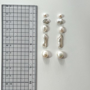 Freshwater Keshi Pearl Earring. White Biwa Pearl Dangle Earring. Mismatched Pearl Drop Earring. Long Pearl Drop Earring. Black Star Earring. image 10