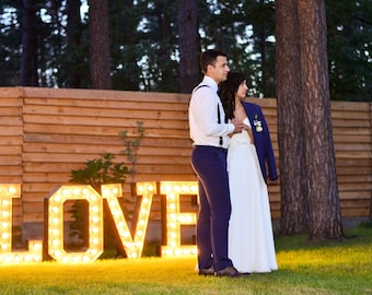 Giant wooden letters. Retro letters with light bulbs. Illuminated brown letters. Big letters and numbers. 4 ft, 3 Ft words. xv big letters/