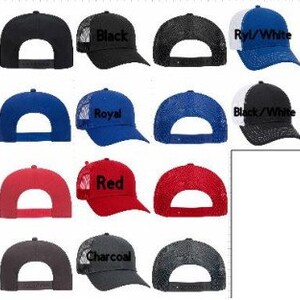 May include: A variety of trucker hats in different colors and styles. The hats feature a mesh back and a variety of embroidered logos, including "Black", "Royal", "Red", "Charcoal", "Black/White", and "Ryl/White".
