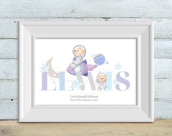 May include: A personalized baby print with the name "Lewis" in large purple letters. Two teddy bears dressed as astronauts are featured, one riding a rocket and the other standing on the letter "W". The print also includes a crescent moon, stars, and the text "Lewis Joseph Johnson Born 25th February 2022".