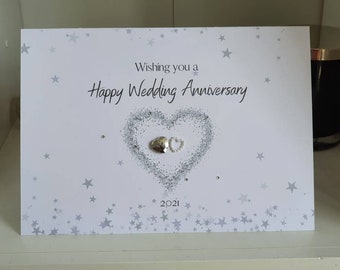 A happy wedding anniversary card, 2 hearts wedding anniversary card, wishing you a happy anniversary card with 2 hearts