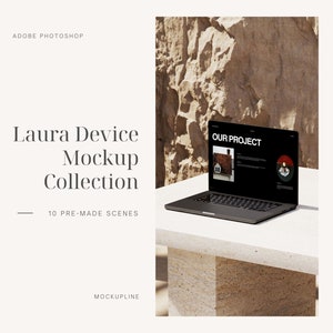 May include: A black laptop computer with a white background. The laptop screen displays a website with the text "OUR PROJECT" and a graphic of a building. The laptop is sitting on a white table with a stone background.