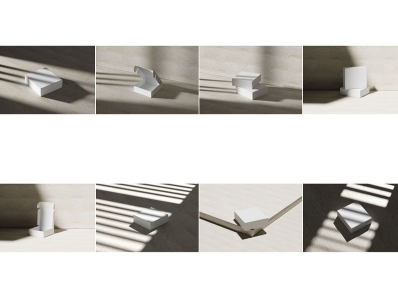 May include: A collection of white square cardboard boxes shown in various configurations, including closed, open, and stacked positions. The boxes feature a clean, matte finish and are displayed under natural light with distinct shadow patterns.