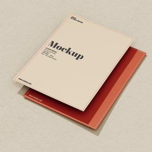 May include: A mockup of a beige card with the word "Mockup" in black text. The card is stacked on top of a red card with a white border.