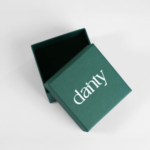 An open green box with the word "dancy" printed on it.