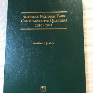 May include: A dark green album titled "America's National Park Commemorative Quarters 2010-2021." The cover has gold lettering and a small gold emblem. The words "Archival Quality" are printed below the title.