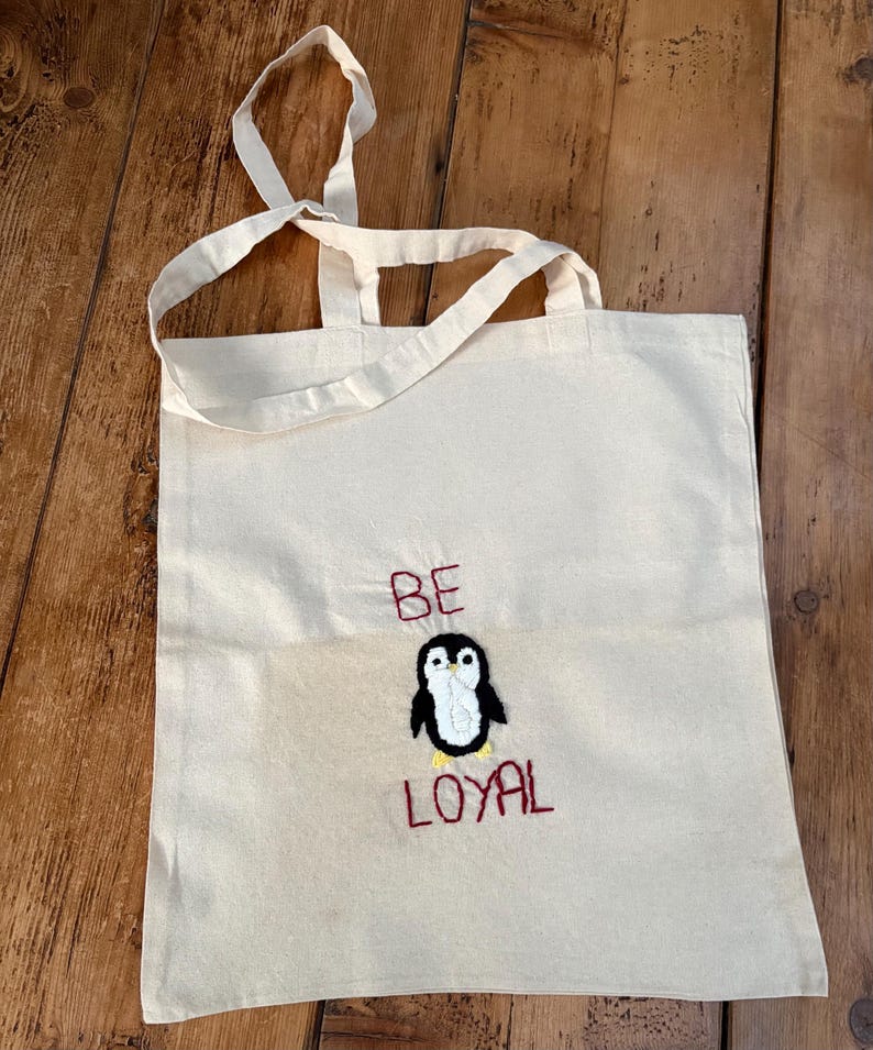 Bolso de mano con bordado a mano de animales y frases positivas. penguin