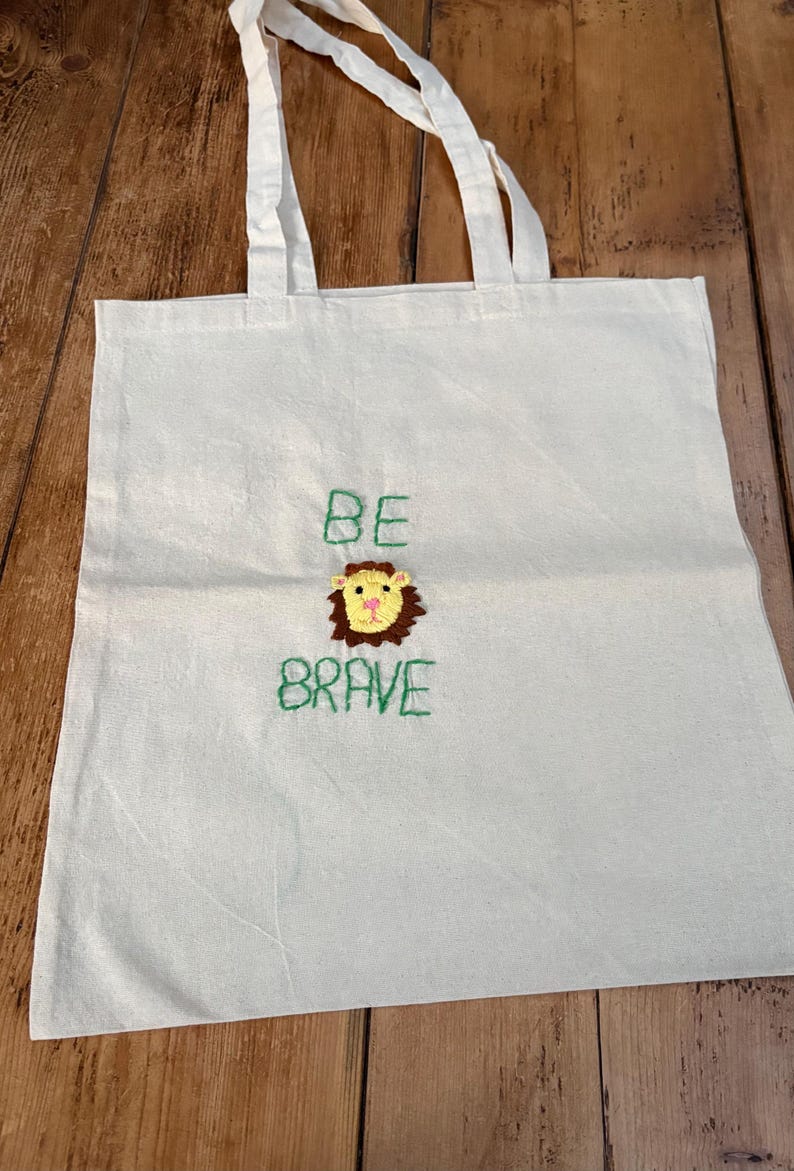 Bolso de mano con bordado a mano de animales y frases positivas. Lion