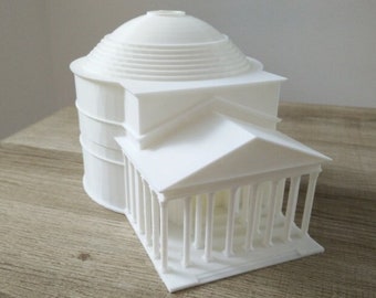 May include: A white 3D printed model of the Pantheon in Rome. The model is detailed and includes the dome, columns, and entrance.