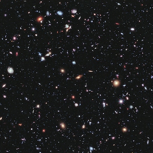 May include: A deep space image showing a vast expanse of black space with countless stars and galaxies scattered throughout. The image is filled with a variety of celestial objects, including spiral galaxies, elliptical galaxies, and star clusters. The image is a stunning example of the vastness and beauty of the universe.
