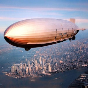 USS Macon marinluftskepp över Manhattan New York fotoaffischtryck färglagd soluppgång