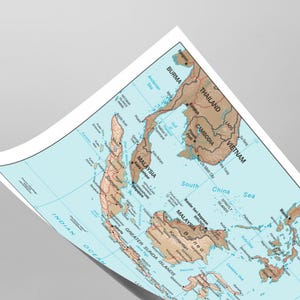 May include: A detailed map of Southeast Asia, showing countries such as Thailand, Vietnam, and Malaysia. The map is in shades of brown and blue, with country names and geographical features labelled. The map is slightly curved.