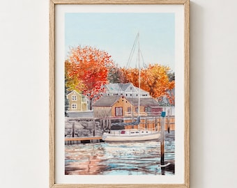 May include: A framed watercolour painting depicting a sailboat moored at a wooden dock in front of a small building. The scene features vibrant orange and red autumn trees under a pale blue sky, with reflections of the boat and foliage on the water.