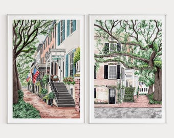 May include: Two watercolor paintings of charming, historic homes with brick facades and lush green trees. The first painting shows a row of houses with a porch and steps, while the second painting shows a single house with a door and a brick walkway.