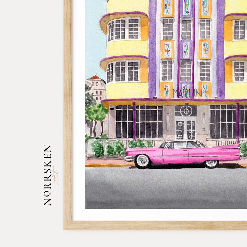 May include: A watercolor art print featuring a bright pink vintage car parked in front of the yellow and purple Marlin hotel building. The architecture displays vertical purple columns, rectangular windows, and floral accents. The text NORRSKEN Art is visible.