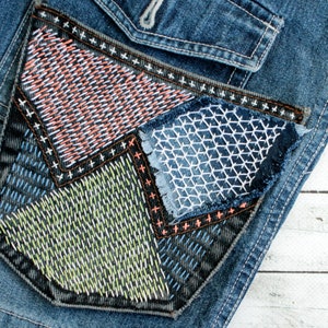Denim boro patch Recycled jeans pocket Sashiko stitching upcycled quilt Visible mending