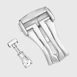 May include: A silver watch band clasp with a deployment buckle. The clasp has a polished finish and a smooth, rounded design.