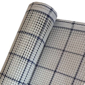 May include: A roll of white canvas needlepoint fabric with blue grid lines. The fabric is rolled up and the grid lines are visible.