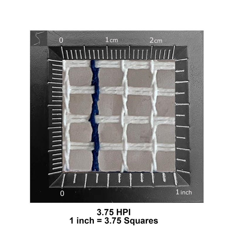 May include: A white needlepoint canvas mesh with a single vertical dark blue thread, positioned against a black frame with a ruler showing 1 inch equals 3.75 squares, labeled 3.75 HPI, indicating a density of 3.75 holes per inch for embroidery.