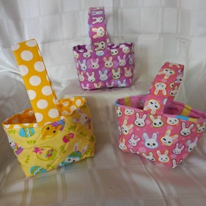 Easter egg basket in three colours,  pink, purple and yellow.