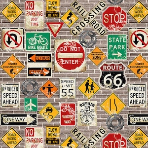 Könnte beinhalten: Ein Hintergrund aus Ziegelmauer mit verschiedenen Verkehrszeichen, darunter "Straßenarbeiten", "Kein Parken", "Geschwindigkeitsbegrenzung 10 MPH", "Bahnübergang", "Einfahrt verboten", "Staatspark", "Route 66", "Im Bau", "Geschwindigkeit reduzieren", "Einbahnstraße", "Umleitung", "Falsche Richtung", "Reparatur", "Fahrradweg", und "Stopp".